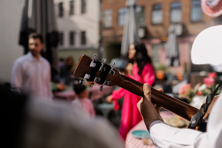 Person Playing The Guitar