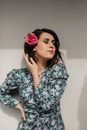 Woman in Blue and White Floral Long Sleeve Shirt