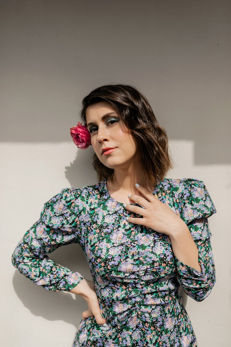 Beautiful Woman In  Floral Dress With Flower On Ear