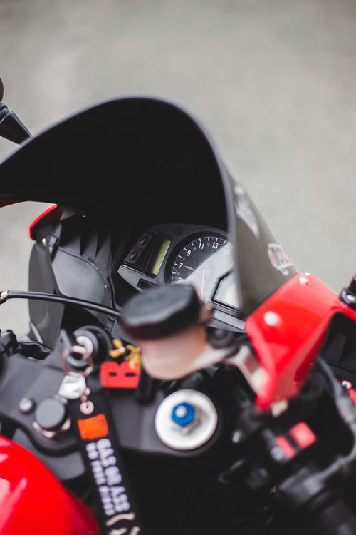 Free Detailed view of a motorcycle's speedometer and handlebars, showcasing modern design. Stock Photo