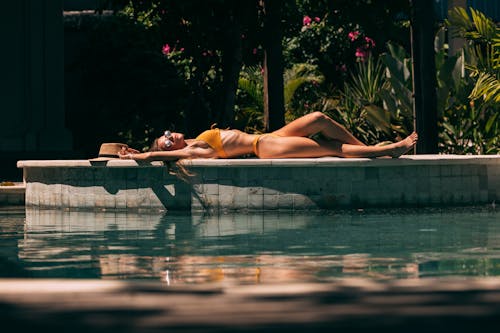 Woman Lying on Swimming Pool