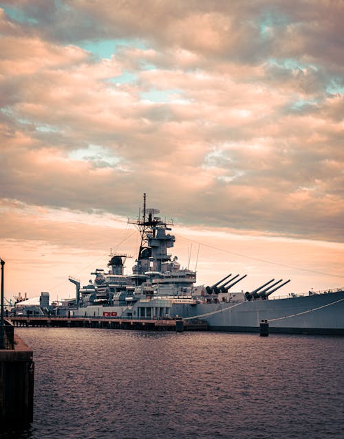 Warship in a Dock at Sunset 