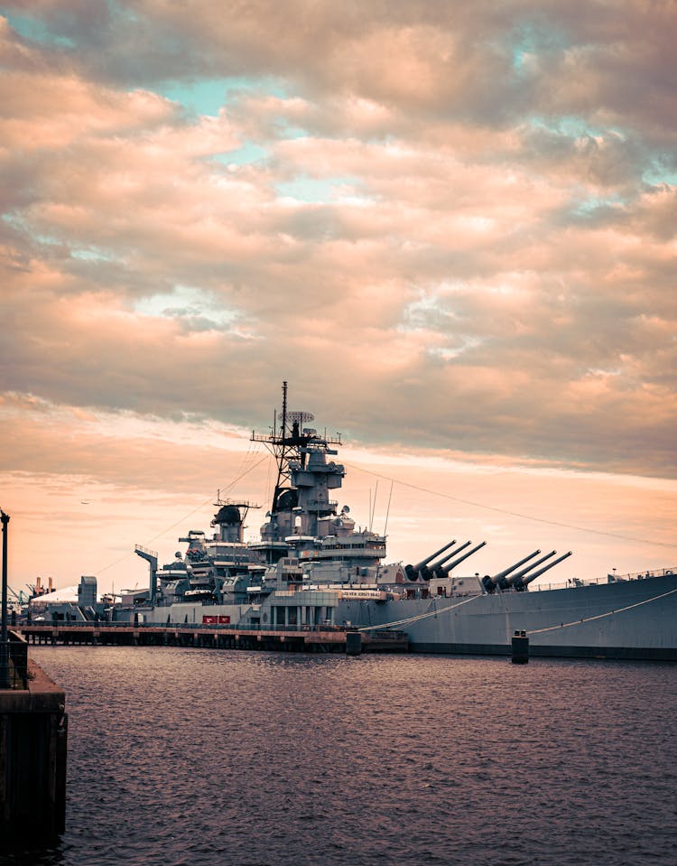 Warship In A Dock At Sunset 