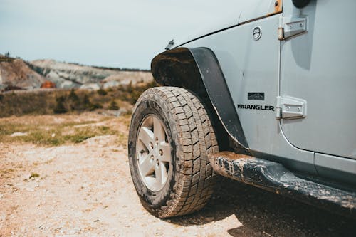 Close-up of a Side of a Jeep Car in an Off-road Area 
