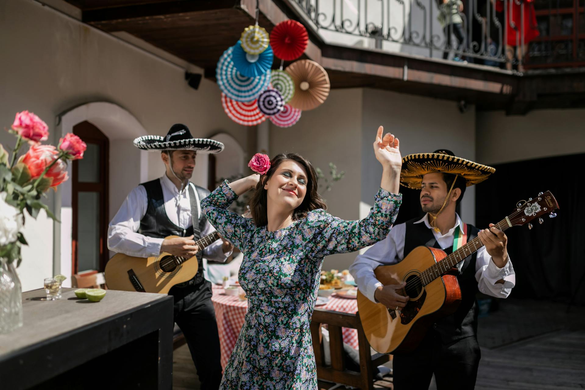 Woman in Dress Dancing and Men in Sombreros Playing Guitars