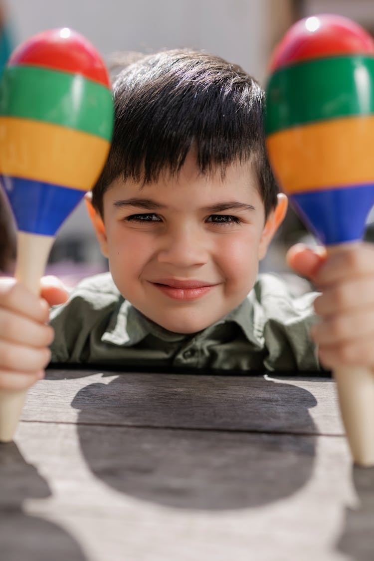 A Boy Holding Maracas 