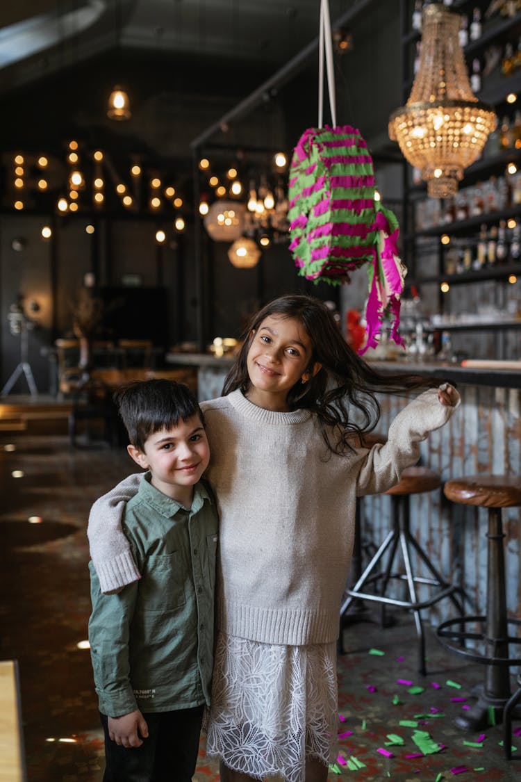 Girl And A Boy Standing In A Restaurant