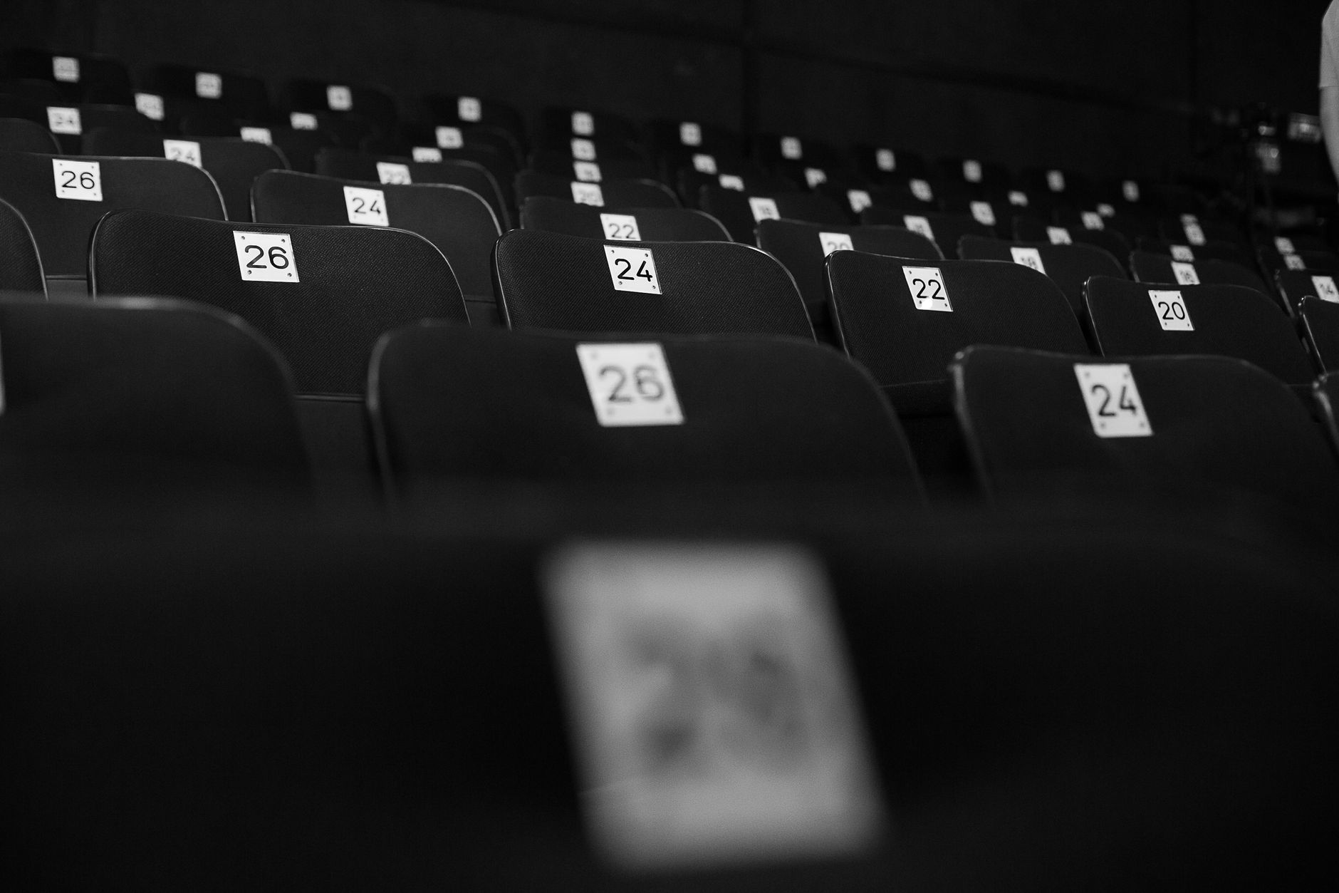 Numbered empty seats in a theatre