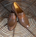 Brown Leather Shoes on a Brown Rattan Surface