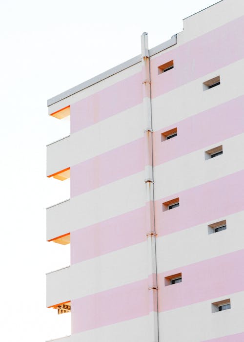 Free White and Pink Concrete Building in Low Angle Shot Stock Photo