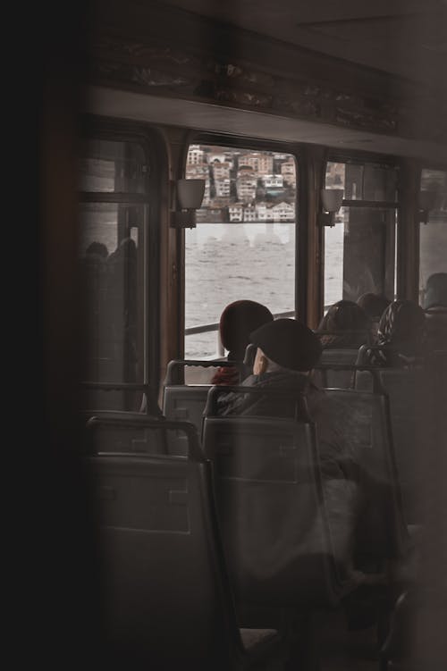 People Sitting in a Ferry Boat