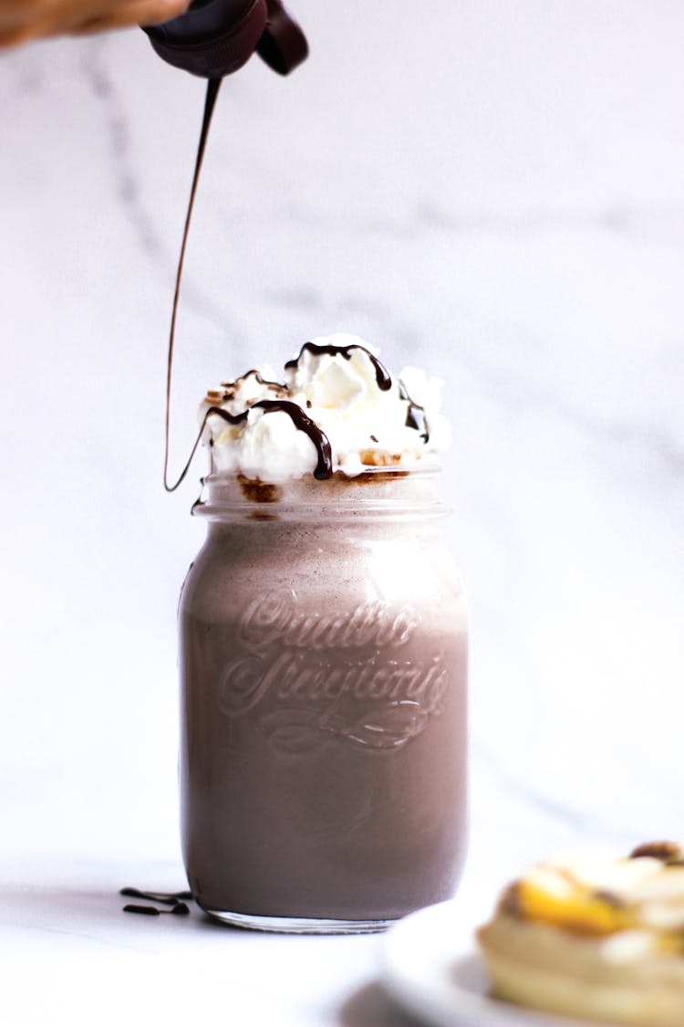 A Chocolate Frappuccino Drink In A Glass Jar