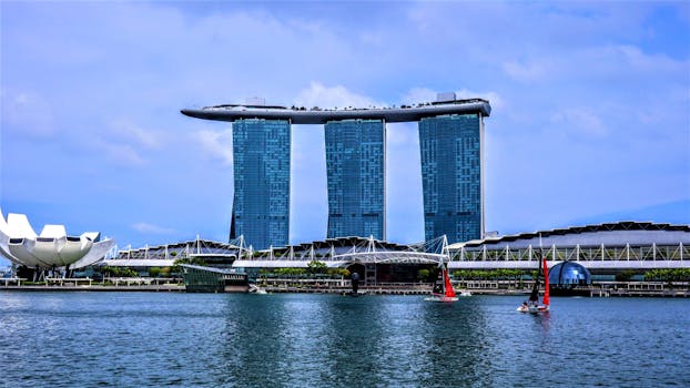 View of Marina Bay Sands and surrounding architecture on a sunny day in Singapore.