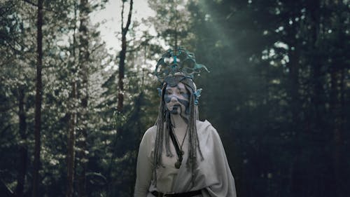 Witch With Face Paint in Forest