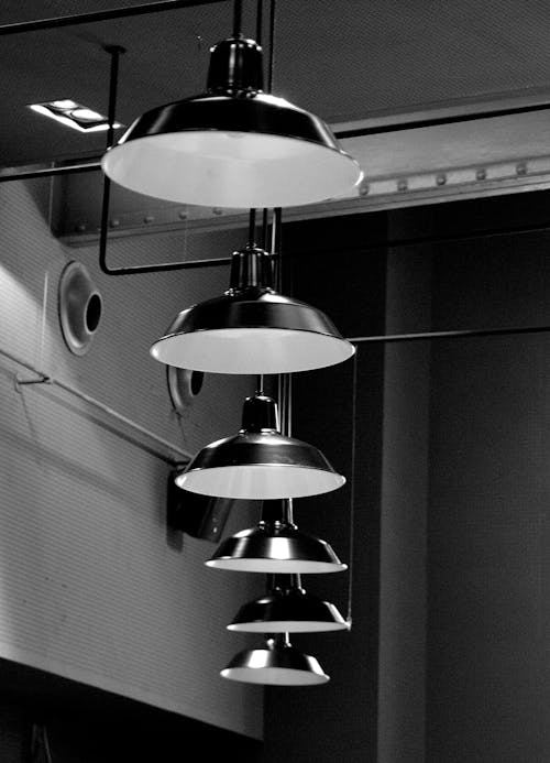 Grayscale Photo of Pendant Lamps