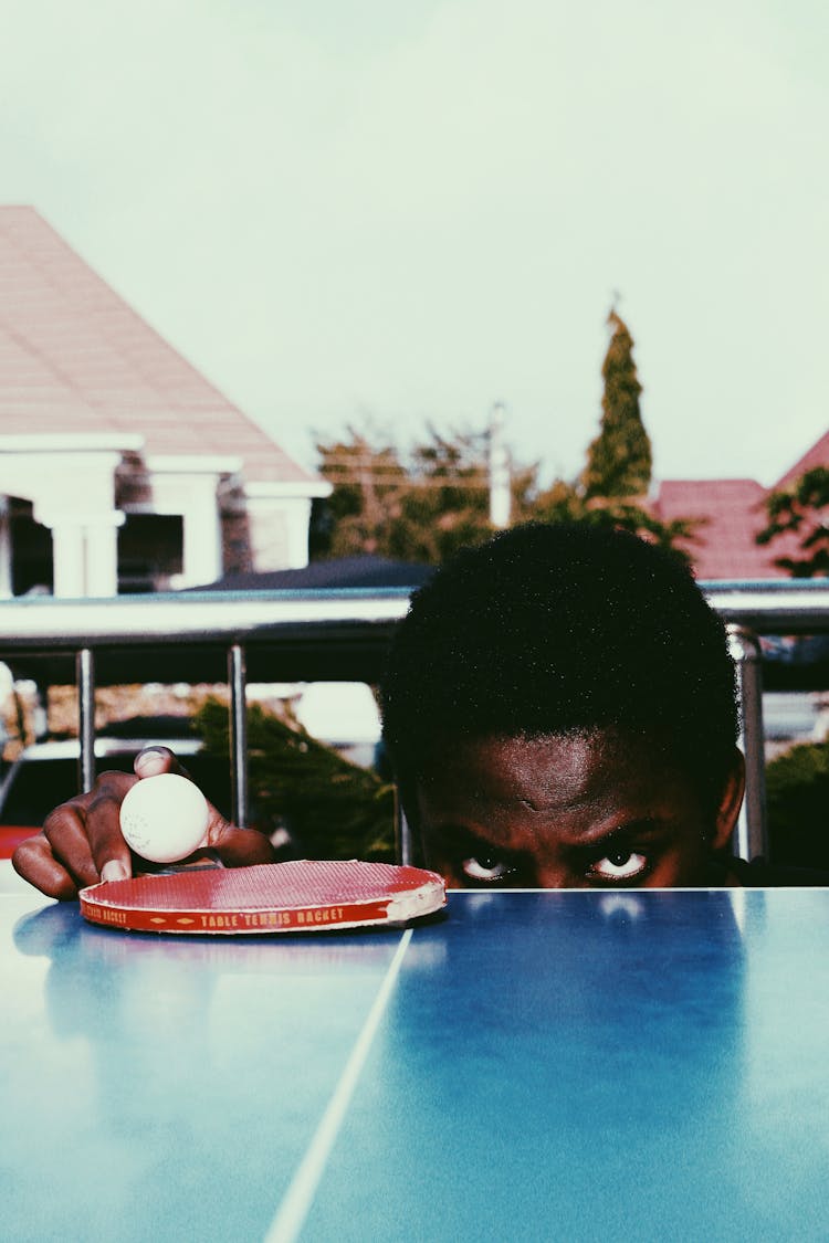 Serious Black Man With Ball For Ping Pong