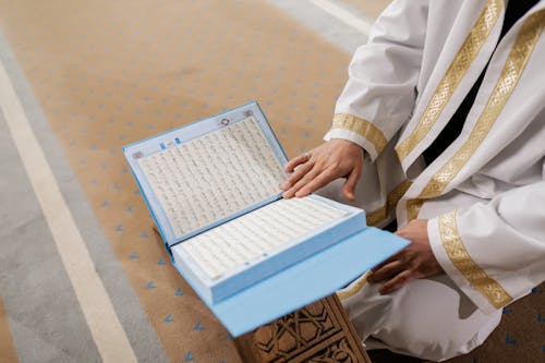 Hand on an Open Koran