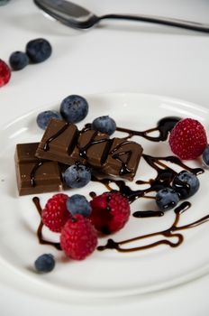 Chocolate Cake With Black Berries on White Ceramic Plate
