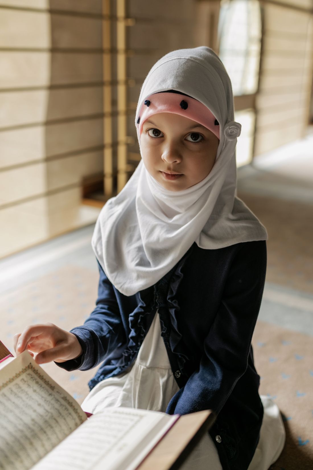 Young Muslim student learning and reading the Quran