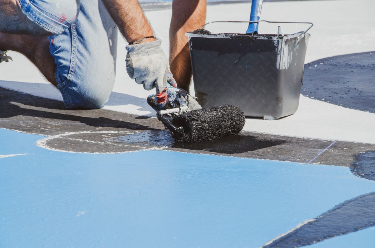 Floor coating applied with rollers on a concrete surface