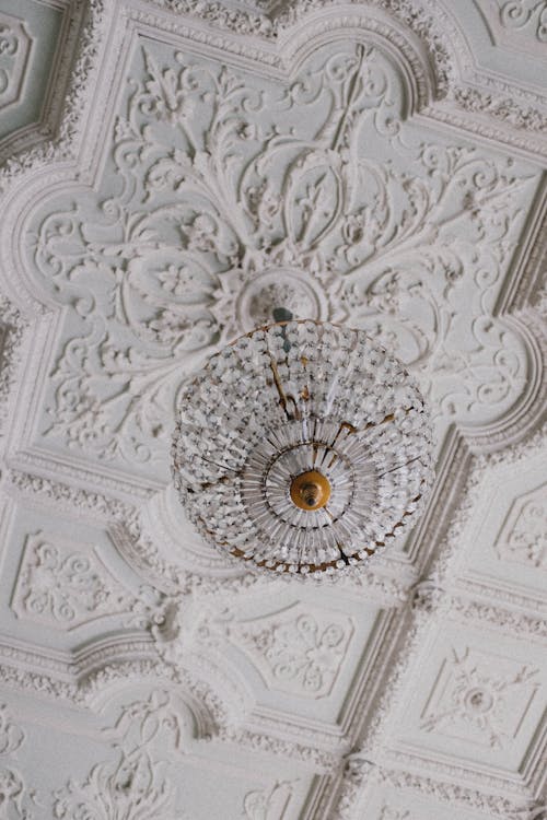 White Intricate Design Ceiling with Light Fixture