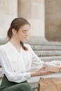 Woman in White Dress Shirt Reading Book