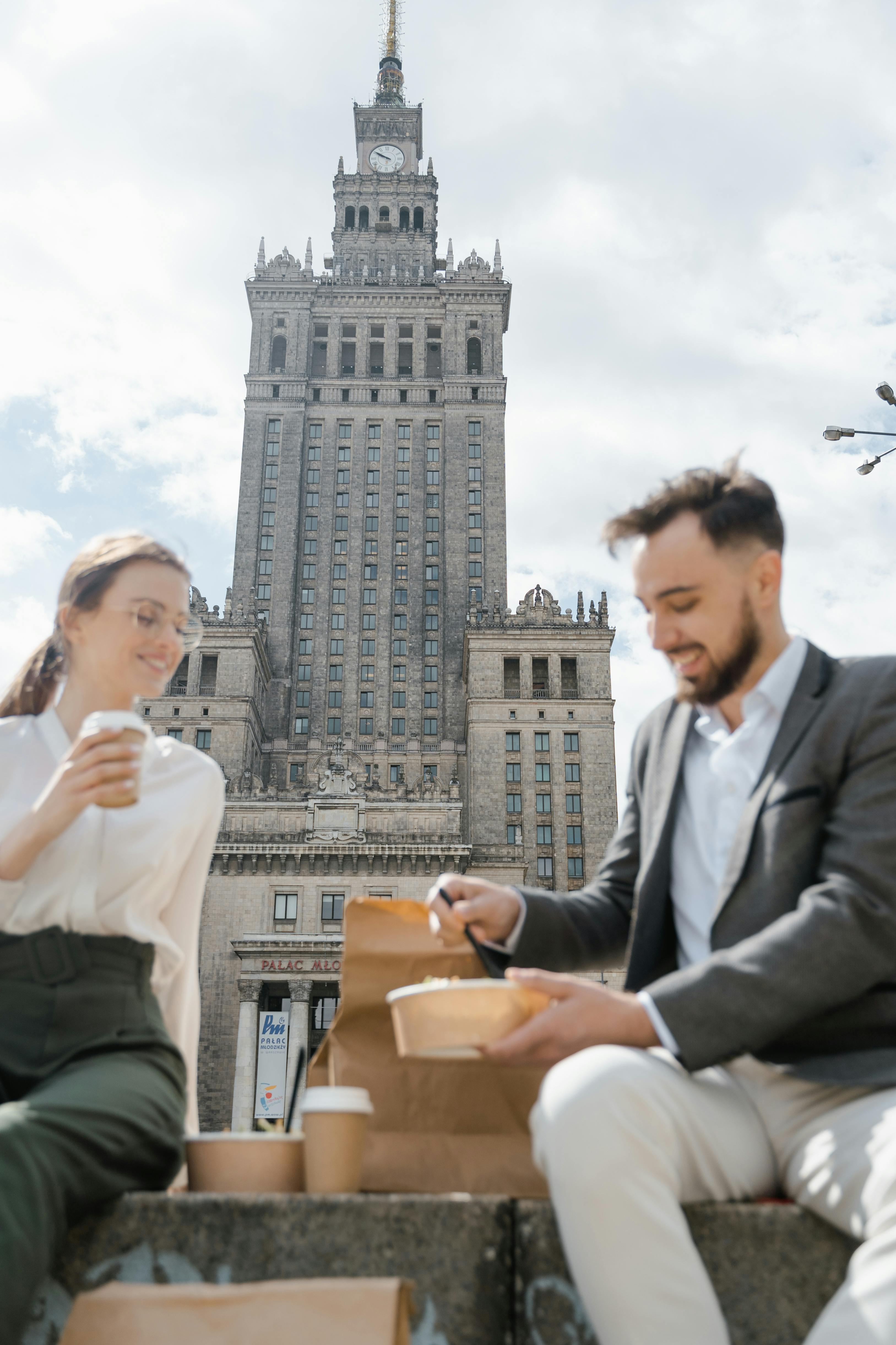 the palace of culture and science behind colleagues in a lunch break