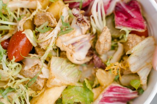 Colorful vegetable salad featuring radicchio, lettuce, tomatoes, and croutons, perfect for a healthy diet.