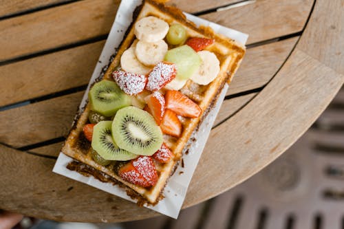 A Waffle with Sliced Fresh Fruit Toppings 