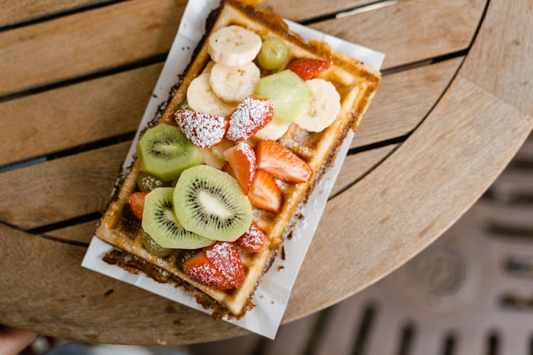 A Waffle With Sliced Fresh Fruit Toppings 