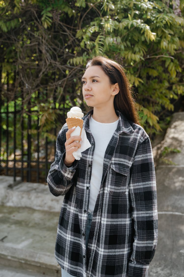 Pretty Woman Holding An Ice Cream In A Cone