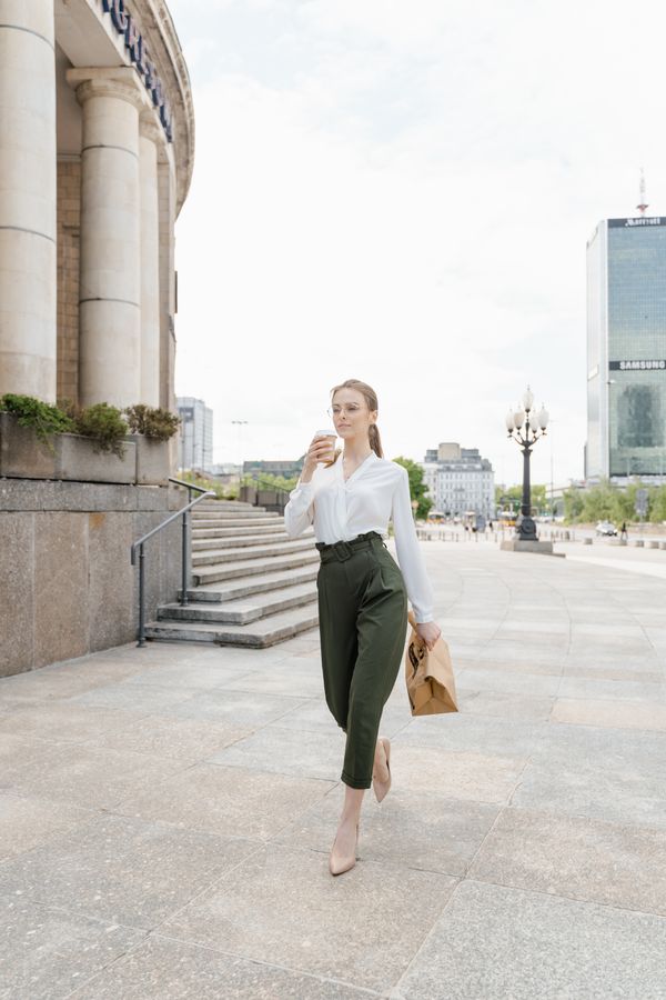 Woman in loafers with ankle-length trousers in smart casual style