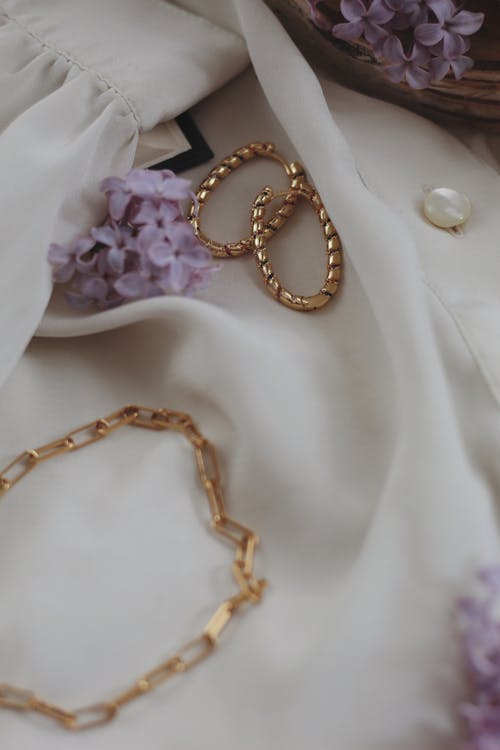 
Golden Accessories over a White Cloth