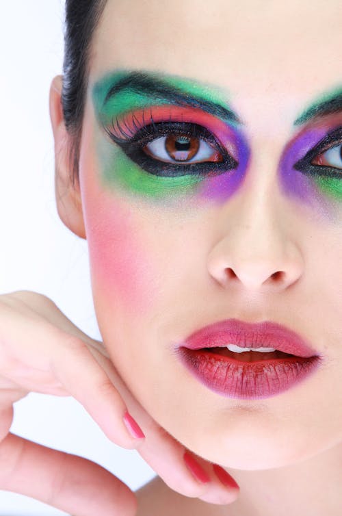 A Woman With Green and Purple Eyeshadow