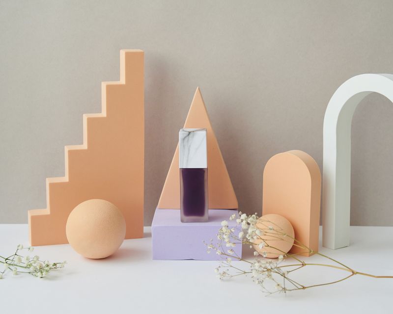 Pastel geometric prop set with a glass bottle — Daria Liudnaya on Pexels