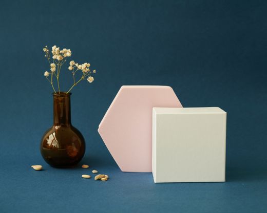 A vase with geometric forms on blue — Photo by Daria Liudnaya on Pexels