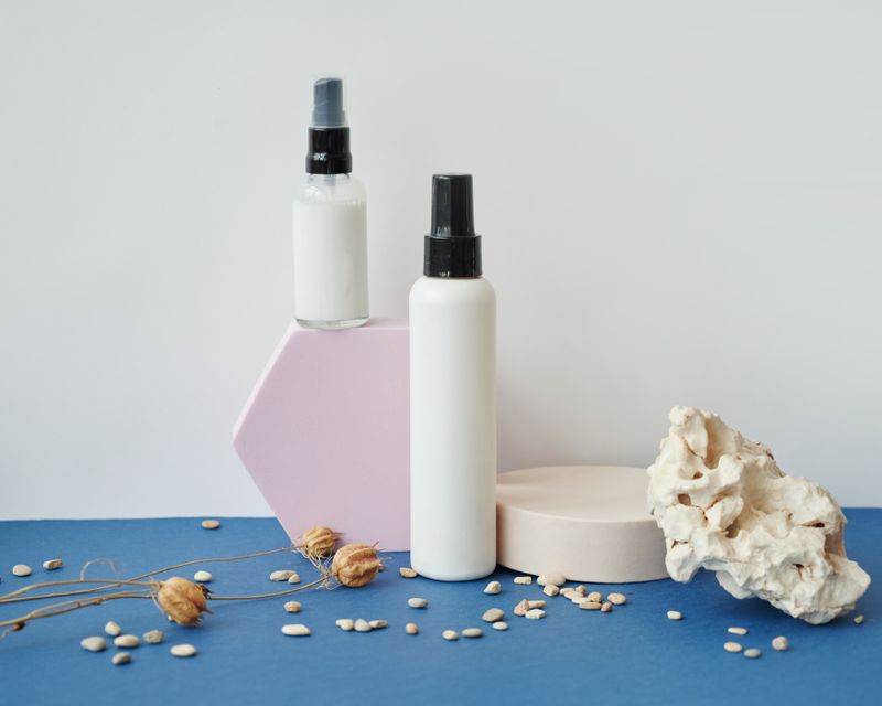 Unbranded skincare bottles styled on a studio set — photo by Daria Liudnaya on Pexels