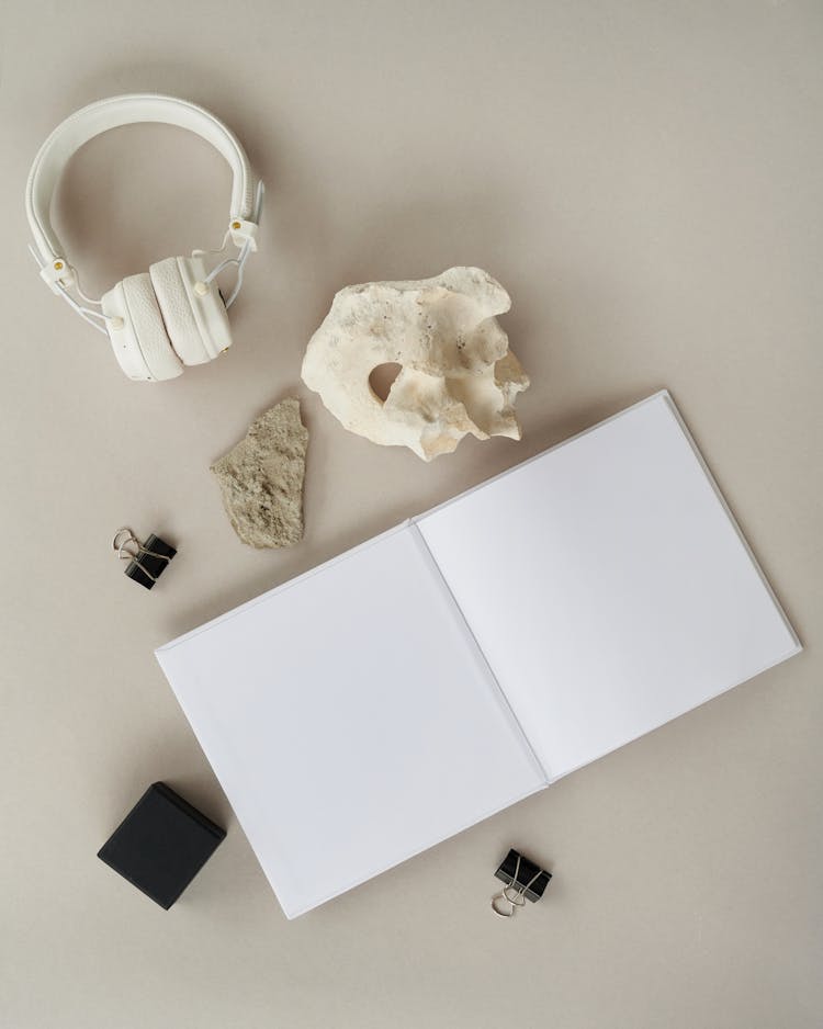 Blank Book And White Headphones