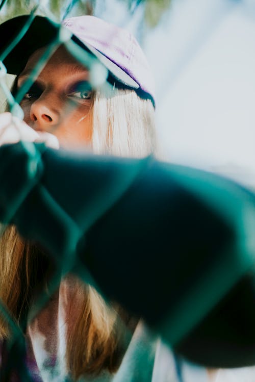 A Woman Wearing Purple Cap