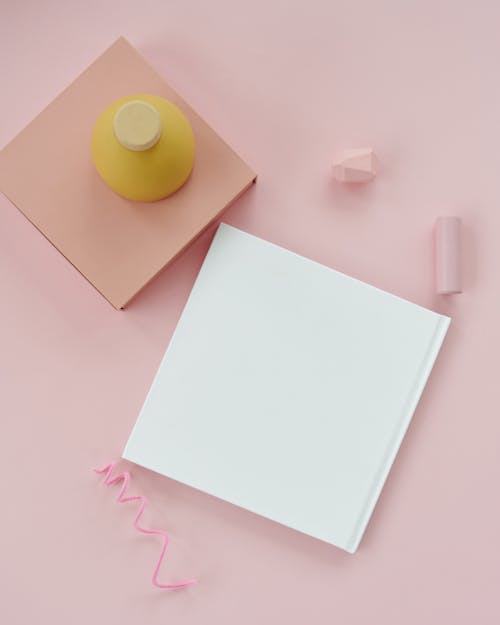 Blank Paper Sheet on Pink Background 