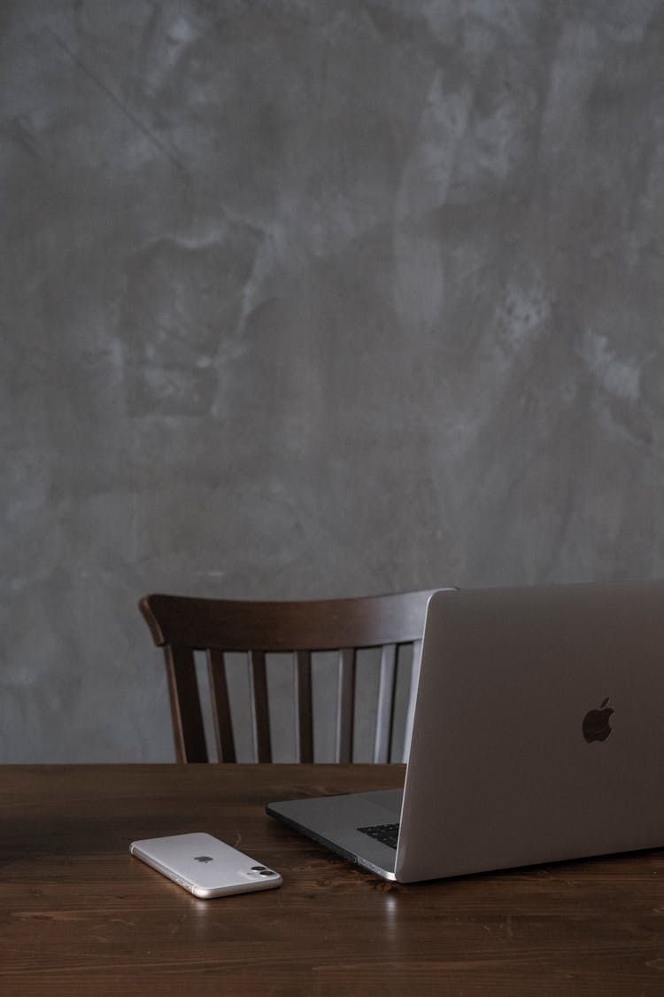 Laptop And Smartphone Placed On Table