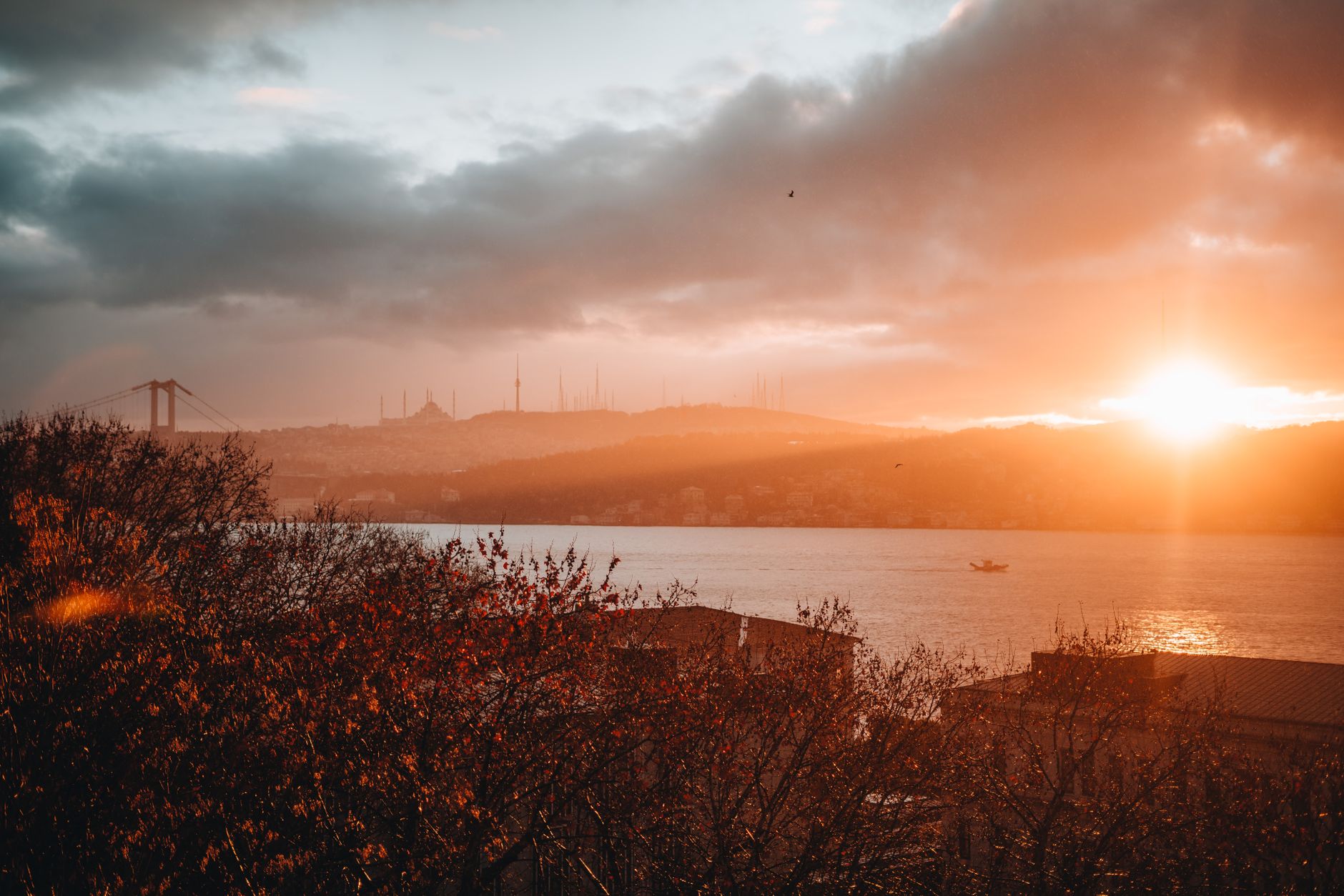 Breathtaking sunrise over the Bosphorus in Istanbul showcasing vivid colors and iconic skyline.