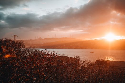 Breathtaking sunrise over the Bosphorus in Istanbul showcasing vivid colors and iconic skyline.