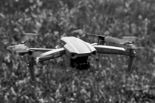 Free 

A Grayscale of a Drone Flying Stock Photo