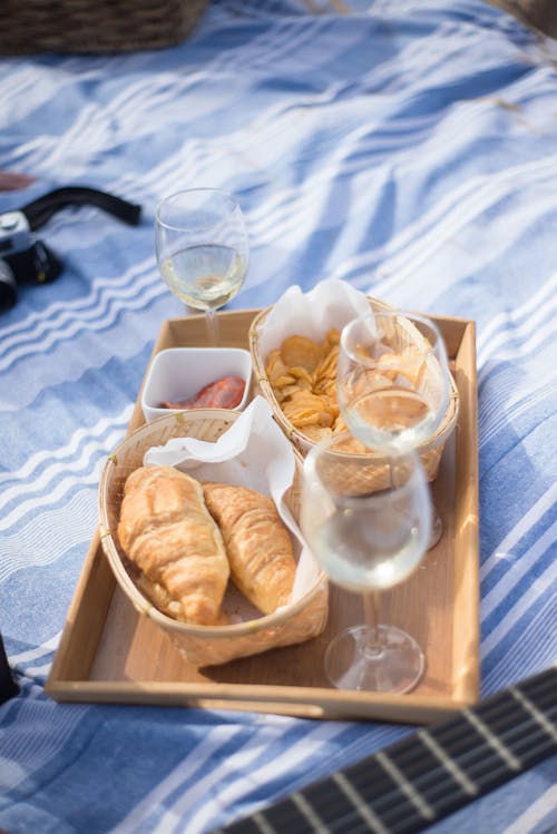 

Food and Wine Glasses on a Wooden Tray