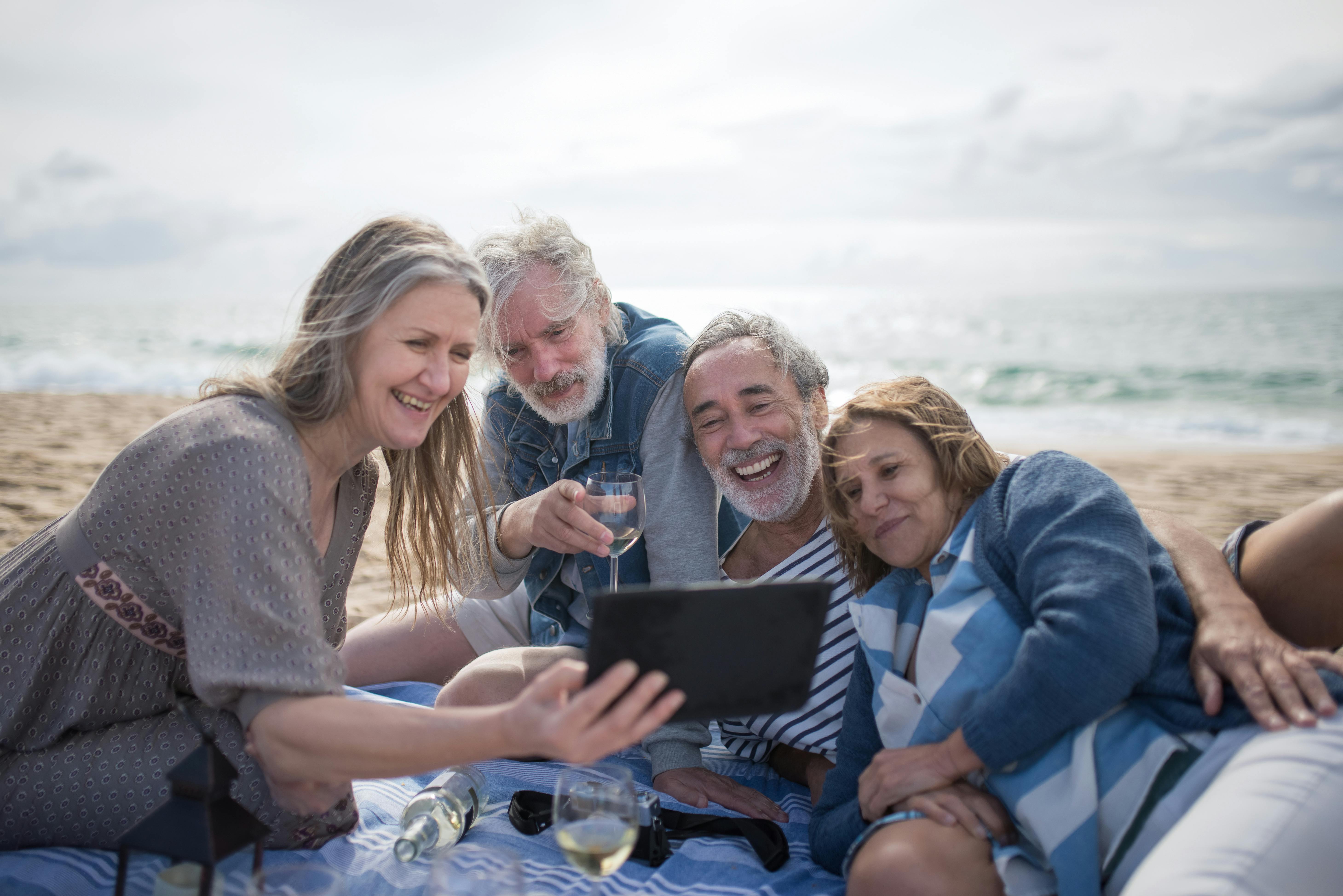 adult people having fun at the beach