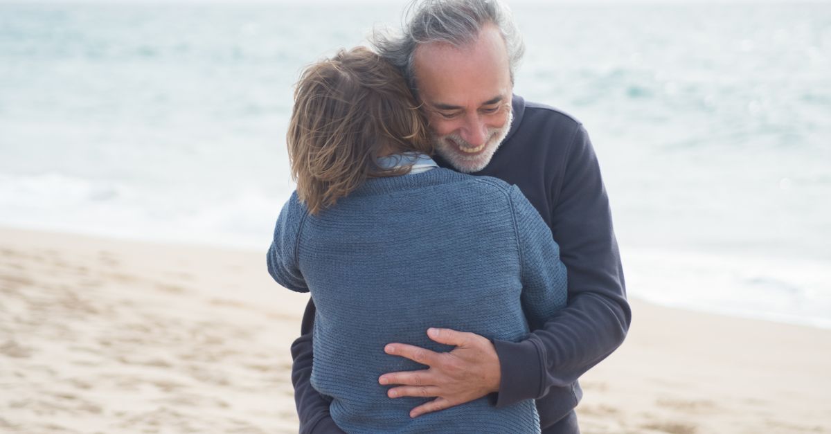 Seeman Hugging Man Hugging the Person at the Beach · Free Stock Photo