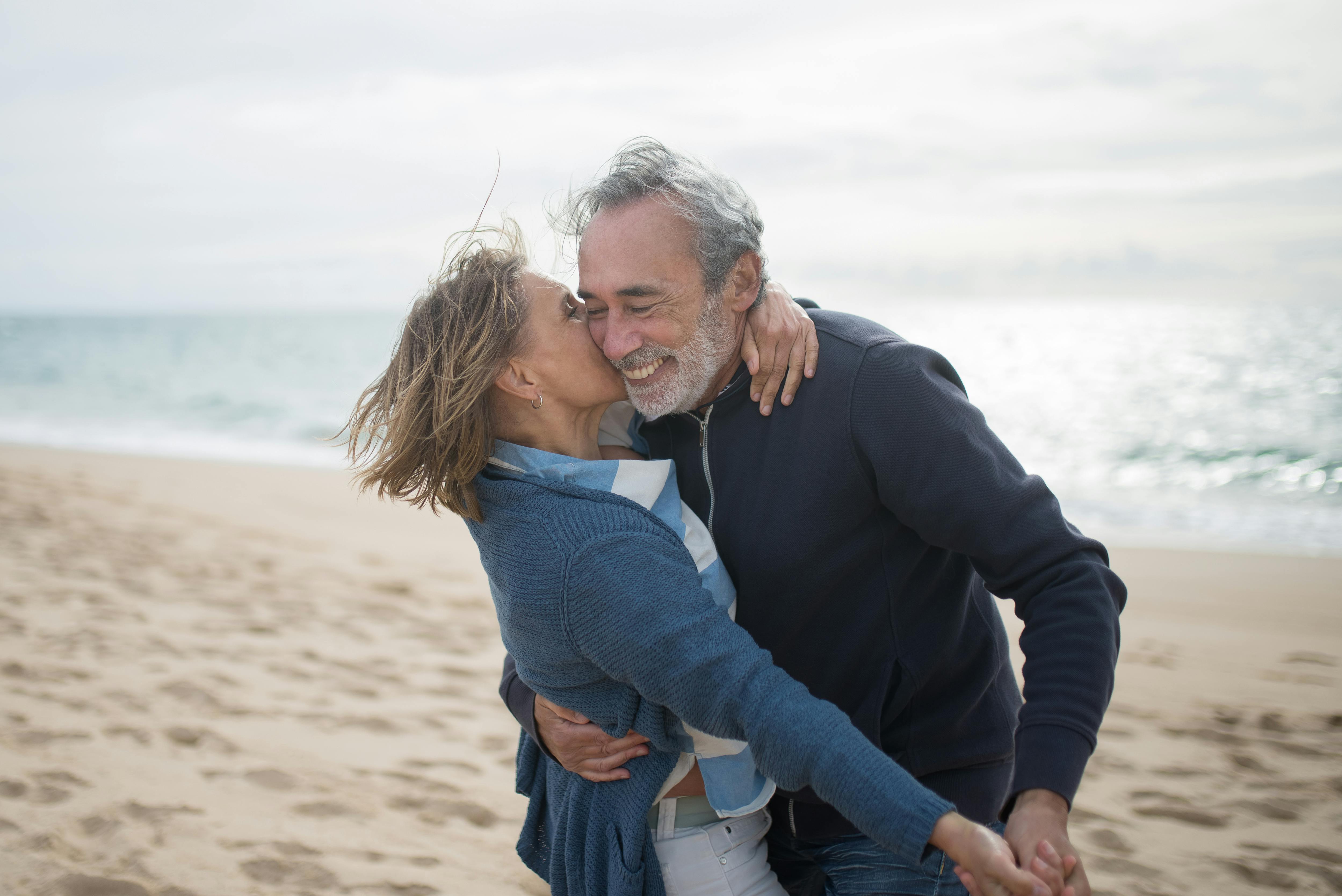 woman kissing the man s cheek