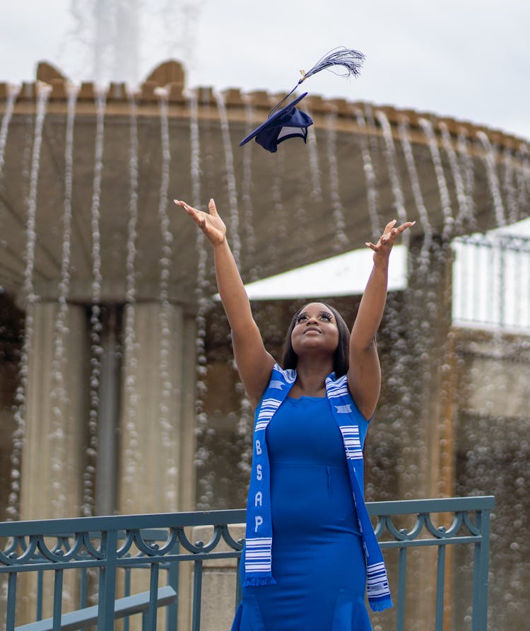 A Woman Throwing Her Graduation Cap