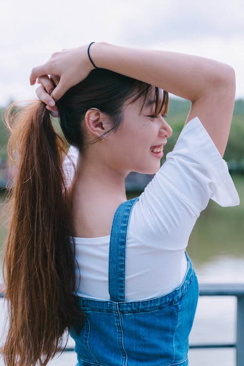 Free Back View of a Woman Smiling  Stock Photo